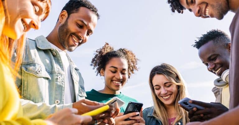 Group of young people on mobile devices