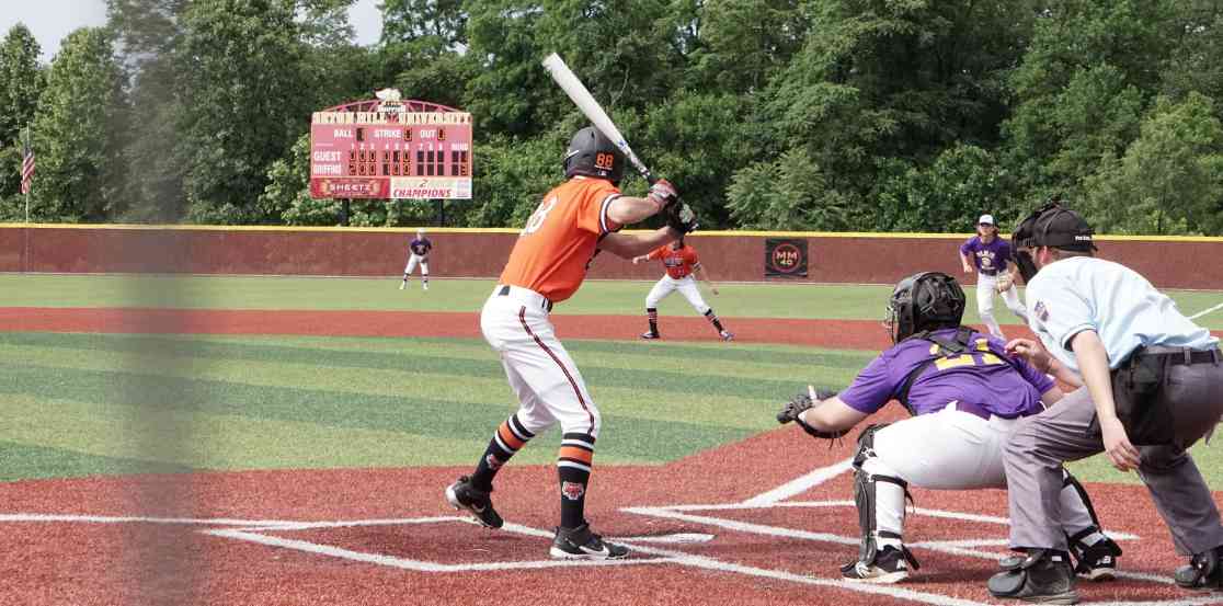 Student playing baseball