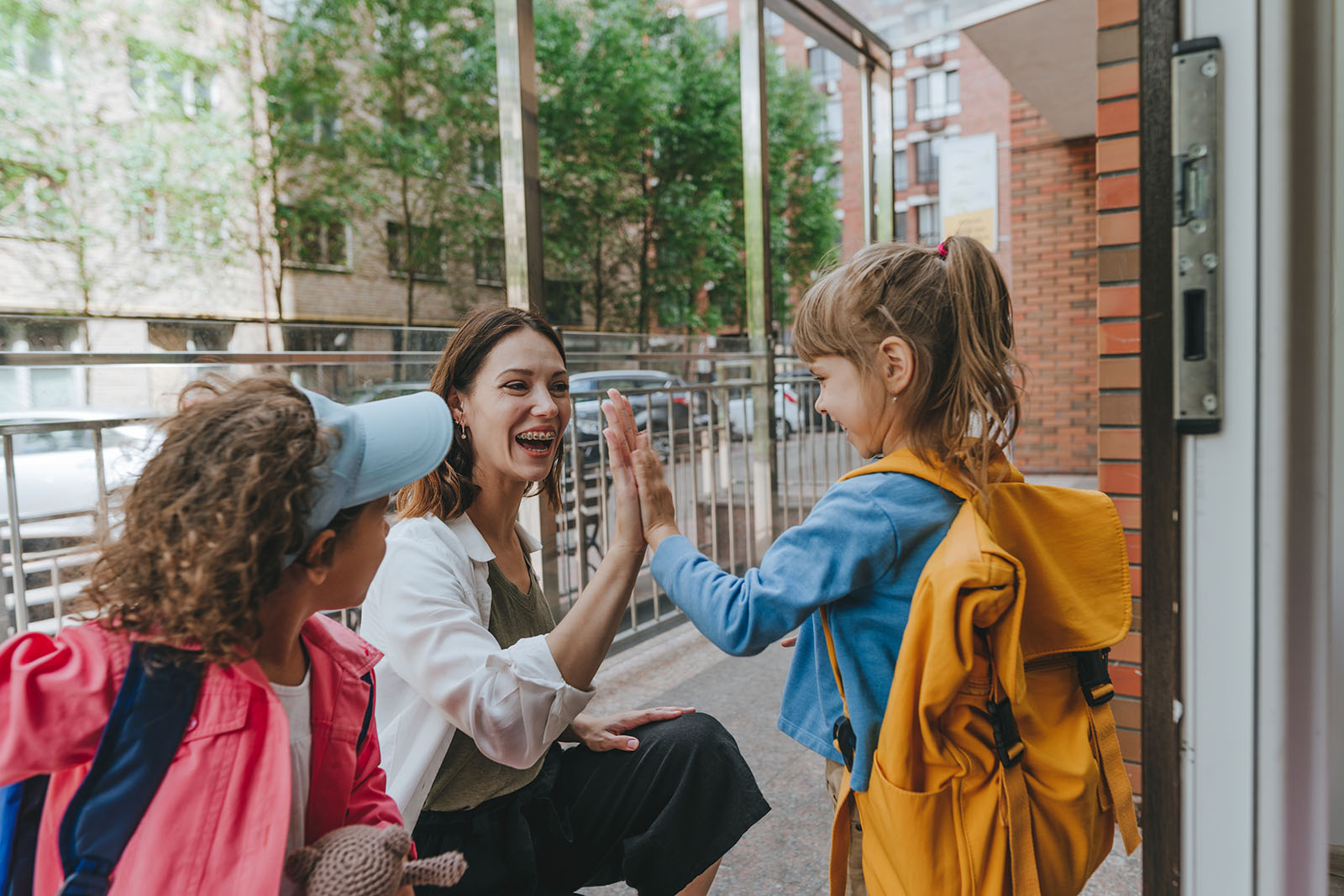 Teacher giving student a high five