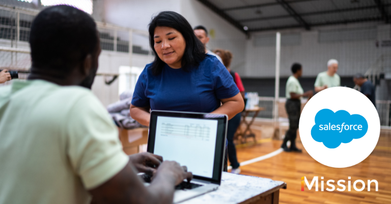 Man on computer volunteering with Salesforce and iMission logos