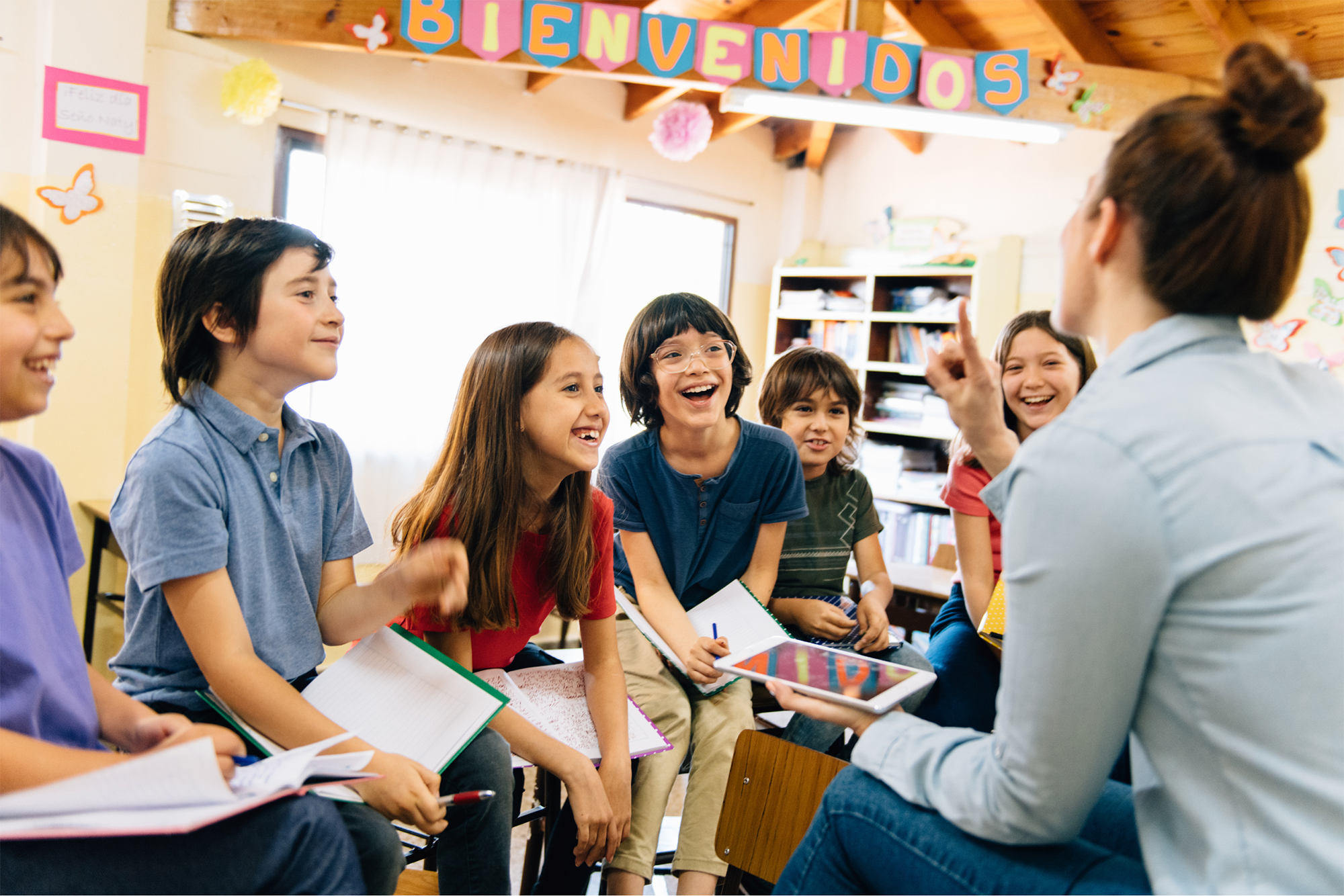 students in a circle with teacher